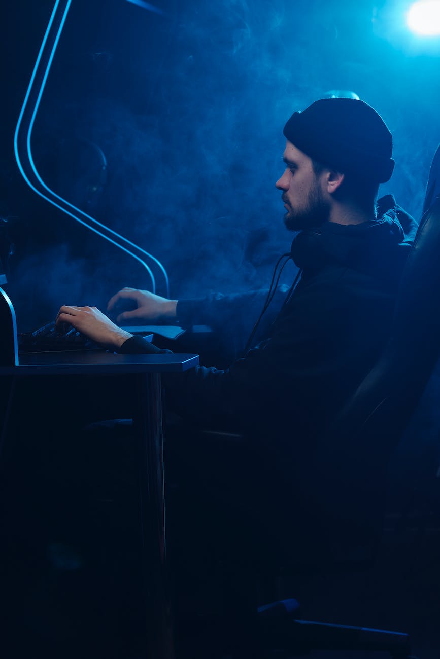 man in black hoodie using computer